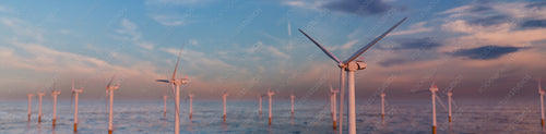 Wind Power. Offshore Wind Turbines at Dusk. Sustainable Electricity Concept.