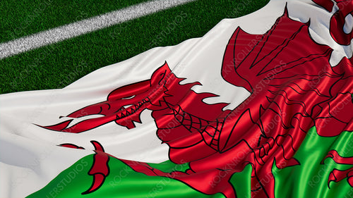Flag of Wales on a Sports field. Grass Pitch with a Welsh Flag. Euro 2020 Football Background.