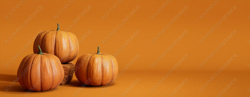 Seasonal background Banner with copy-space. Trio of Pumpkins on Orange color. Fall Concept.