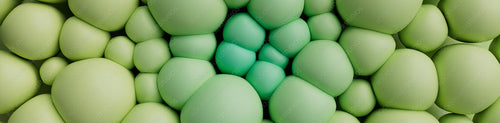 Green and Aqua 3D Balls squash together to make a Multicolored abstract background. 3D Render.