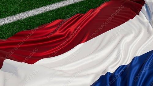 Flag of Netherlands on a Sports field. Grass Pitch with a Dutch Flag. Euro 2020 Football Background.
