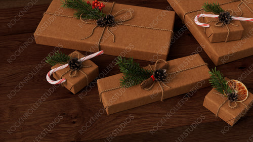 Christmas Presents on a Dark Wood floor, with Hand Crafted decorations.