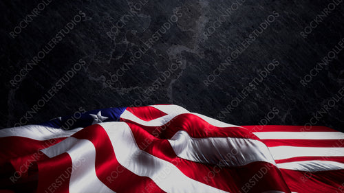 US Flag Banner for Independence Day on Black Stone. Authentic Holiday Background with Copy-Space.