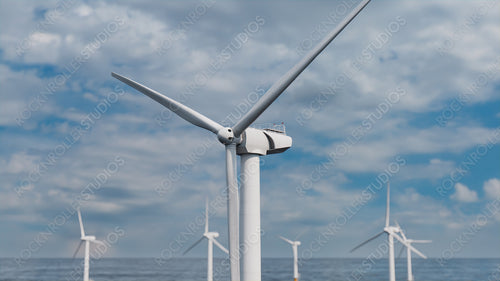Wind Turbines. Offshore Wind Farm on a Cloudy Afternoon. Environmental Electricity Concept.
