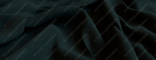Dark Green Cloth Background with Wrinkles. Luxury Surface Texture.