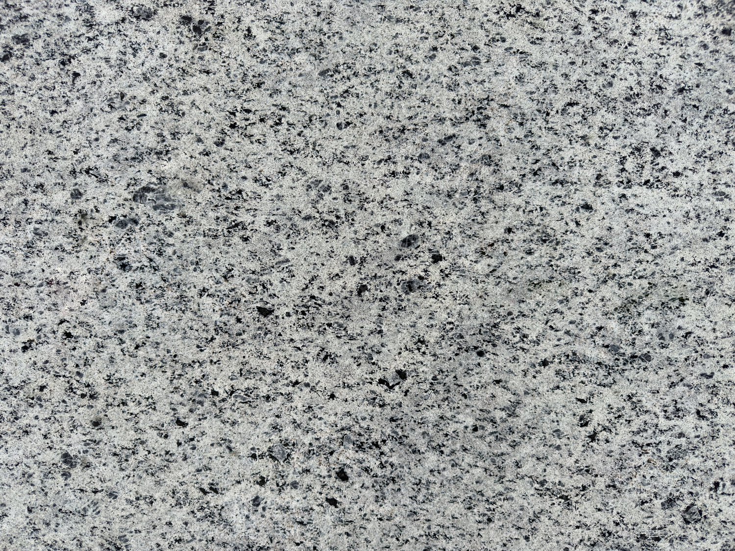 Rugged Elegance: Close-Up of Speckled Grey Granite with Natural Textures