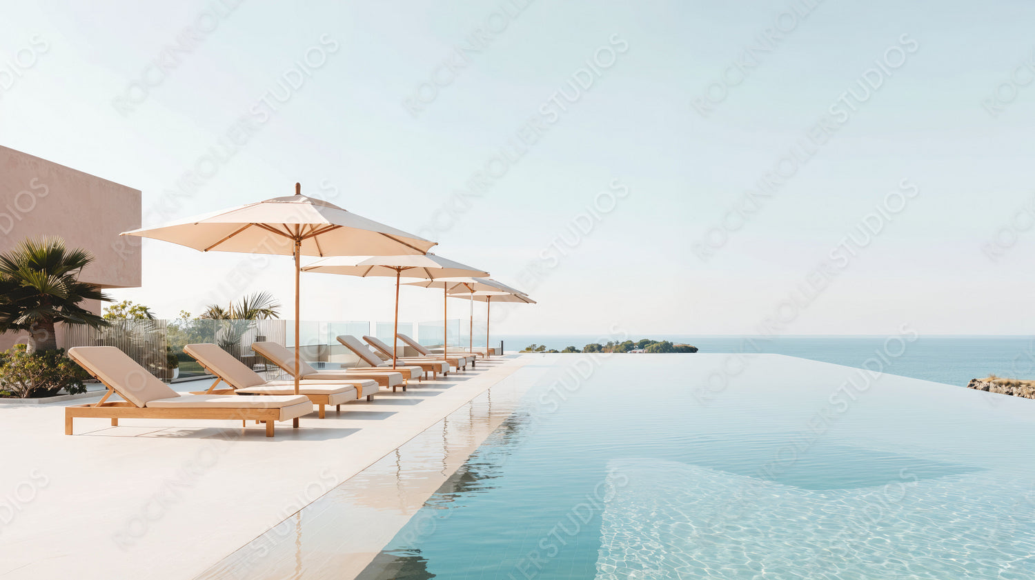 Luxury Infinity Pool with Ocean View and Sun Loungers Under Umbrellas