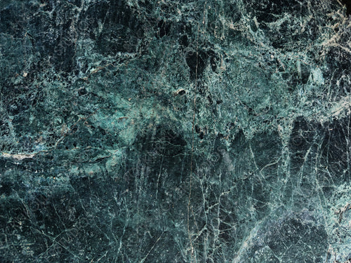 Rugged Stone Surface with Green and Earthy Color Patterns