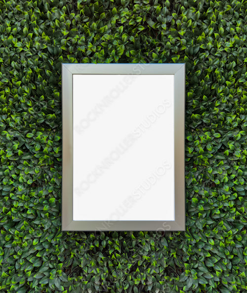 Silver Frame in Lush Green Hedge: Perfect Eco-Friendly Wall Mockup for Creative Displays