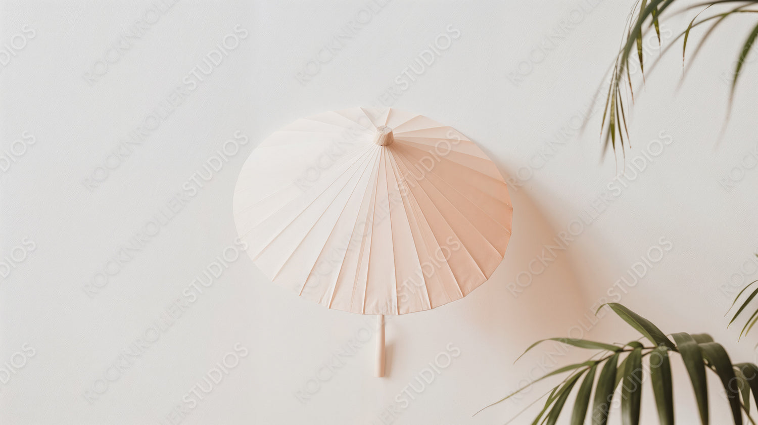 Elegant Pink Parasol Against a Minimalist White Wall