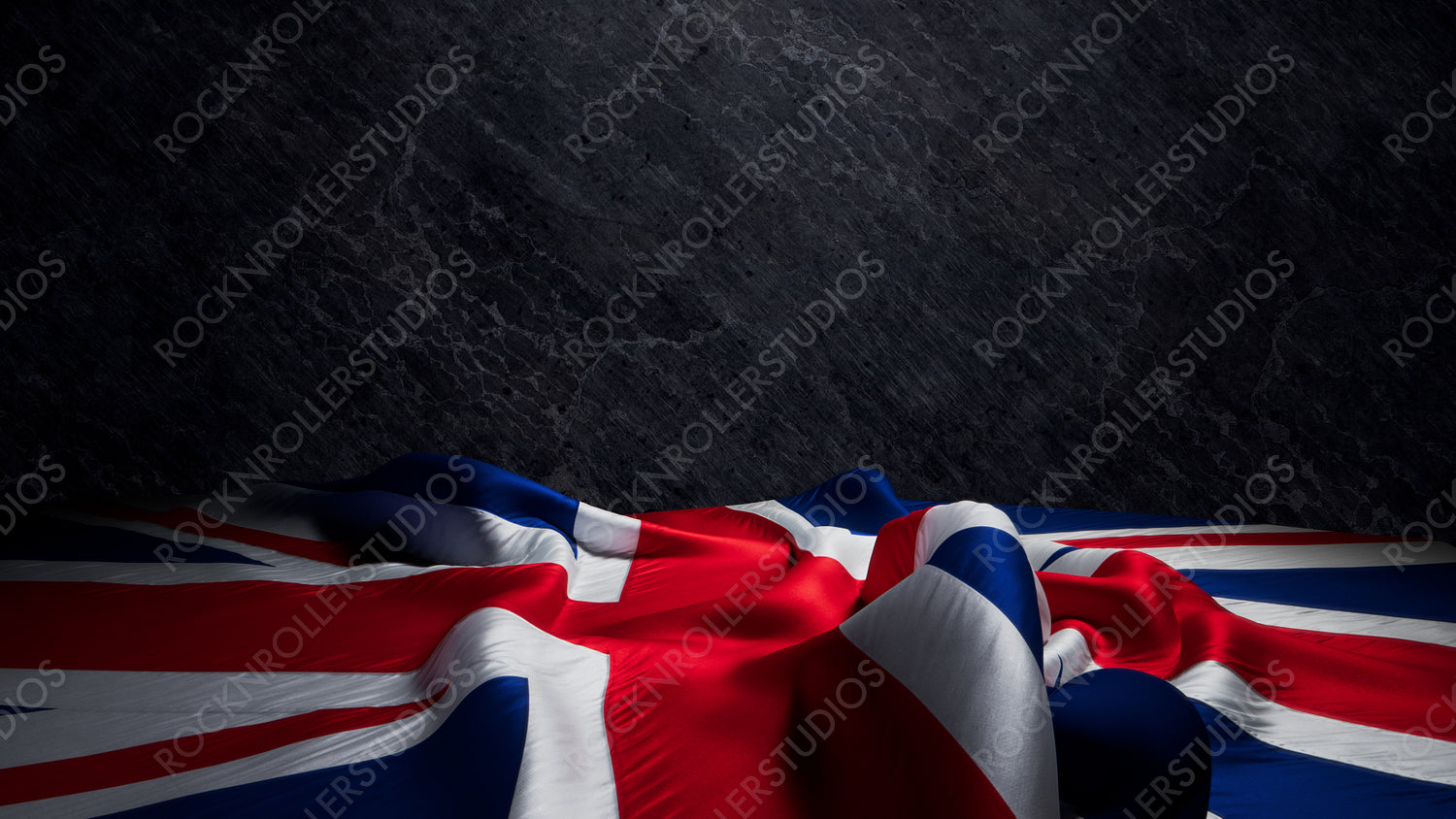 Dramatic UK Flag Draped on Textured Stone Wall: A Symbol of British Pride. Premium Background with copy-space