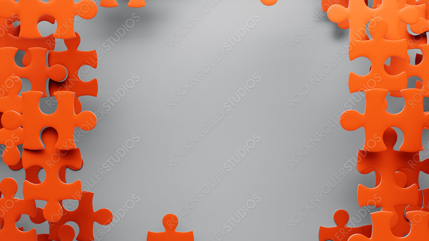 Vibrant Orange Puzzle Pieces on Grey: A Study in Connection and Creativity