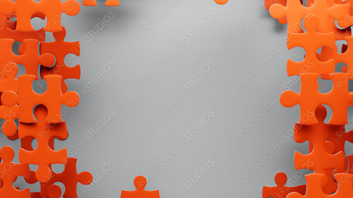 Vibrant Orange Puzzle Pieces on Grey: A Study in Connection and Creativity