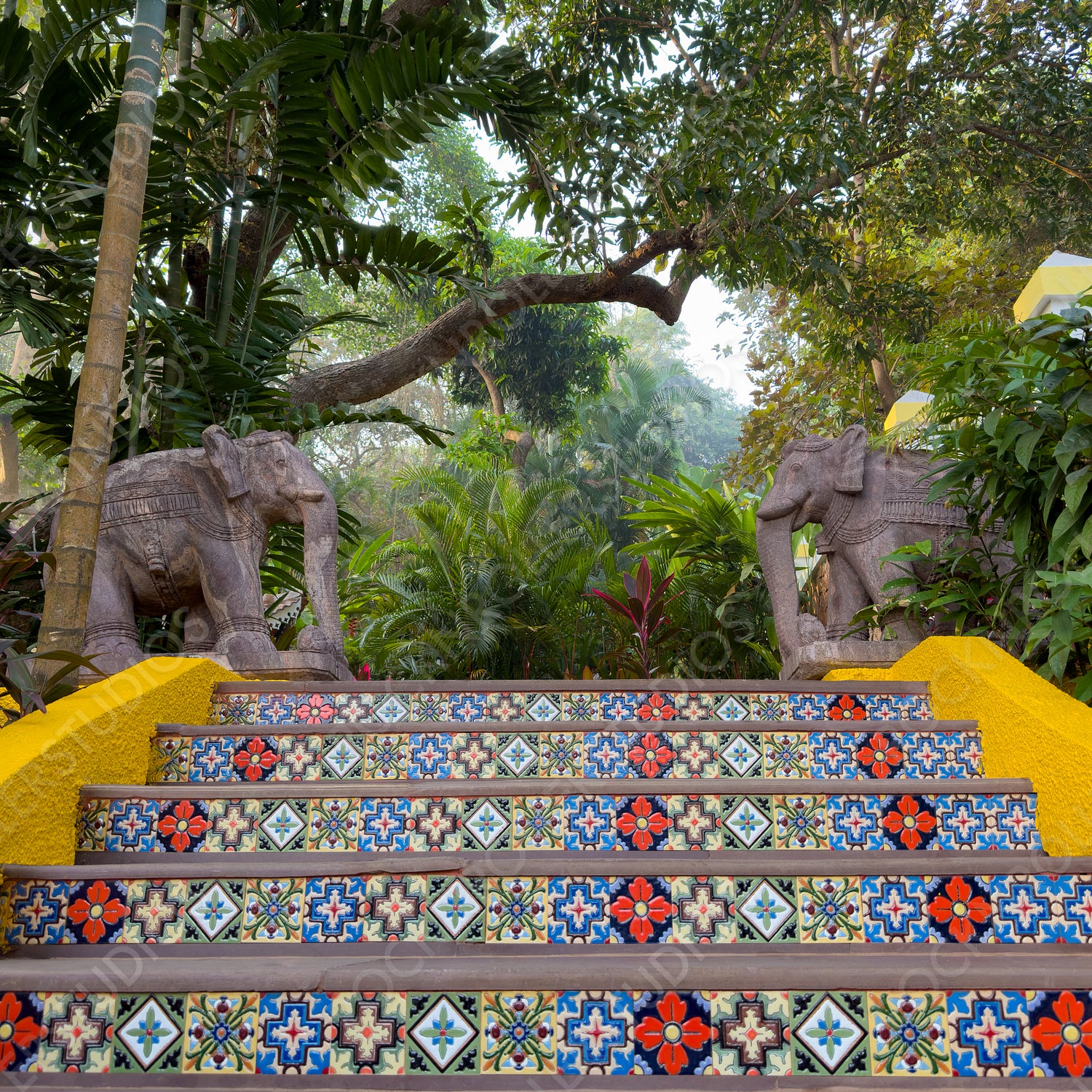 Enchanting Tropical Garden Staircase with Colorful Tiles and Elephant Statues