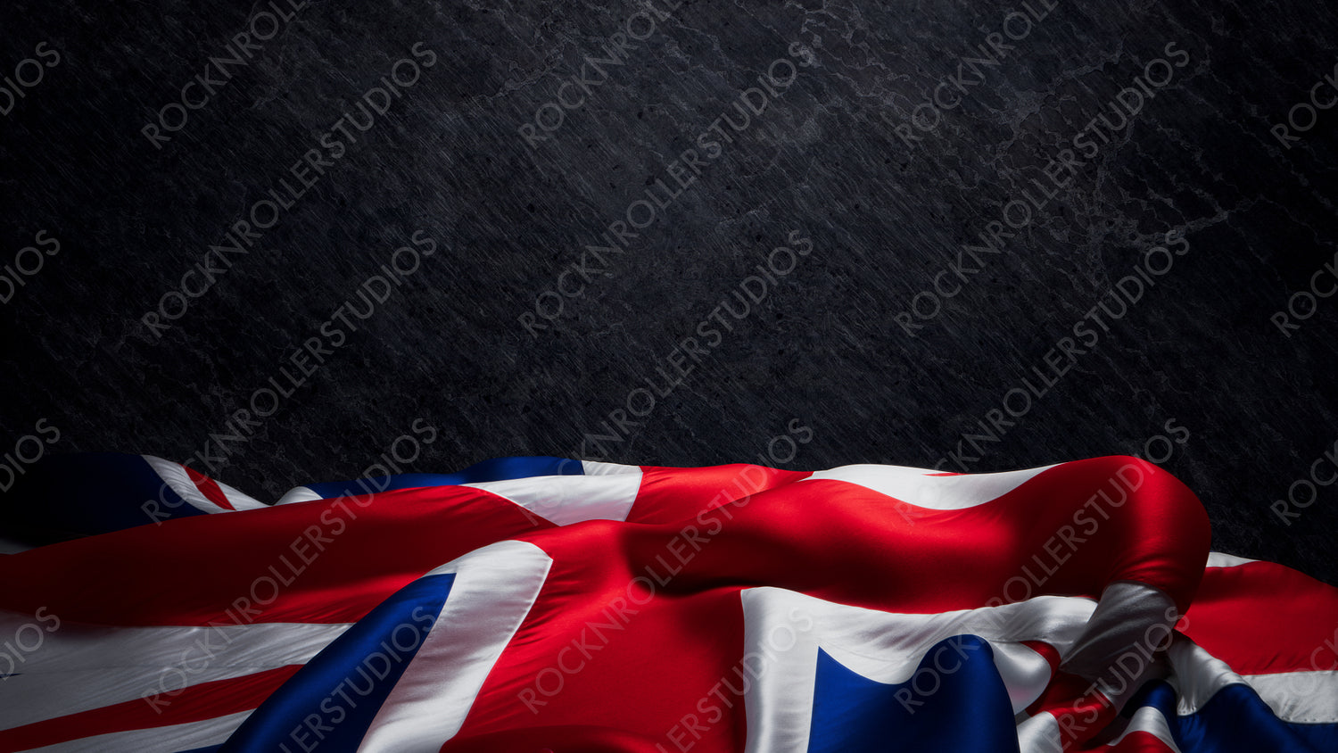 Dramatic Union Jack: Vibrant Colors and Moody Lighting Against a Dark Stone Background with copy-space