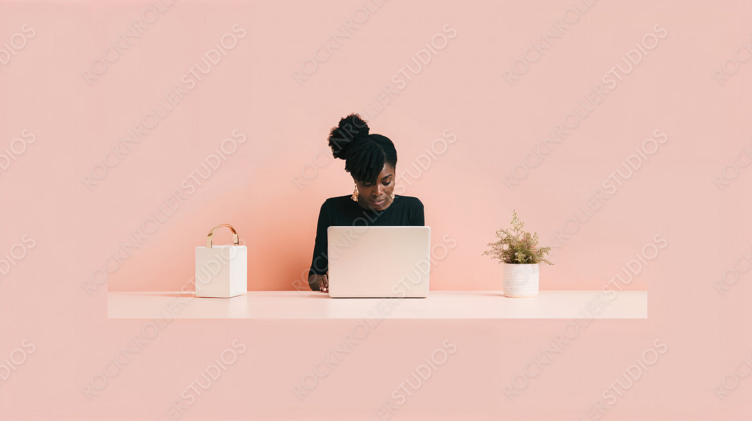 Remote Work Concept with Woman Using Laptop in Minimalist Setting