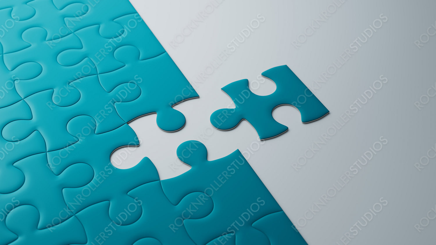 Teal Jigsaw Puzzle Near Completion on Sleek Grey Surface: A Symbol of Strategy and Connection