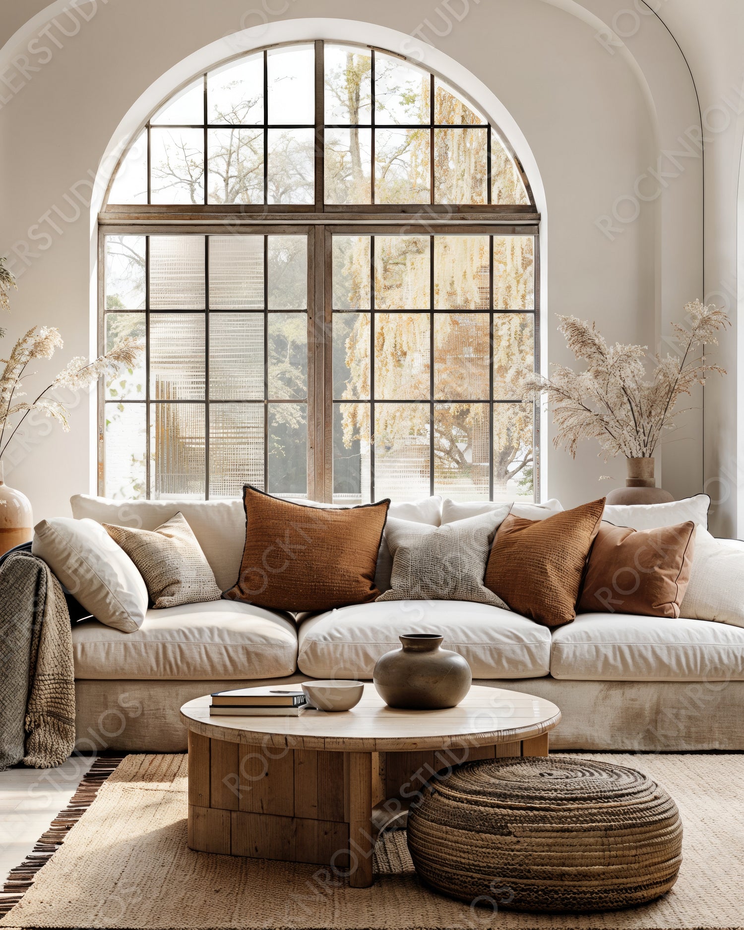 Cozy Modern Living Room with Arched Window Overlooking Autumn Landscape