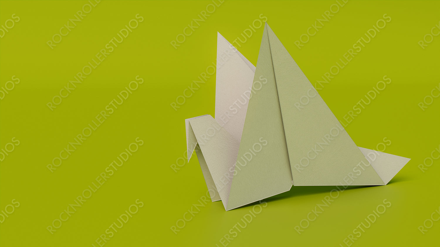 Bird made from folded White paper against Green background. Origami concept with Copy Space.