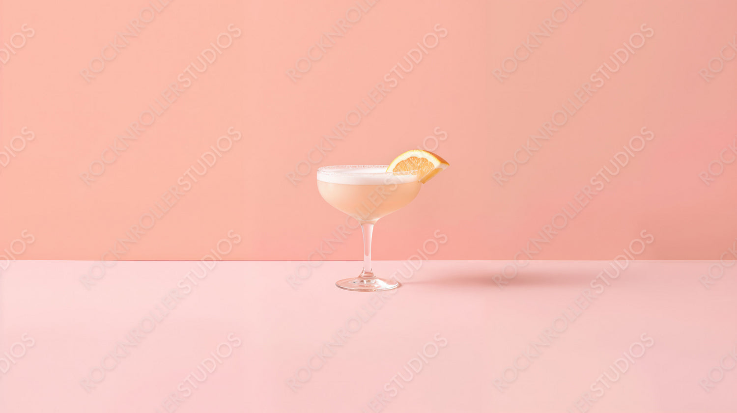 Refreshing Lemon Cocktail in a Glass on a Soft Pink Background