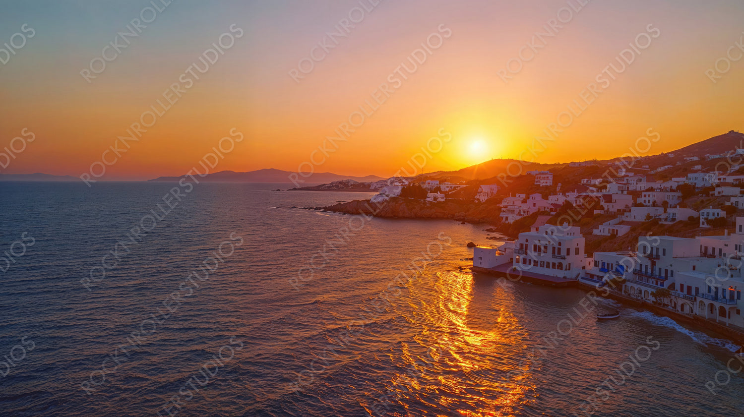 Sunset Over White-Washed Coastal Village with Ocean View