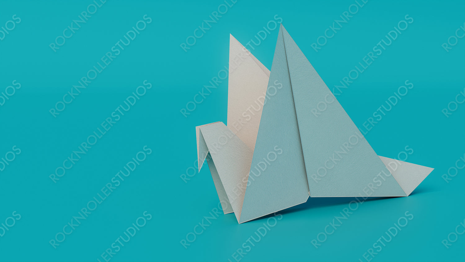 Bird made from folded White paper against Turquoise background. Origami concept with Copy Space.