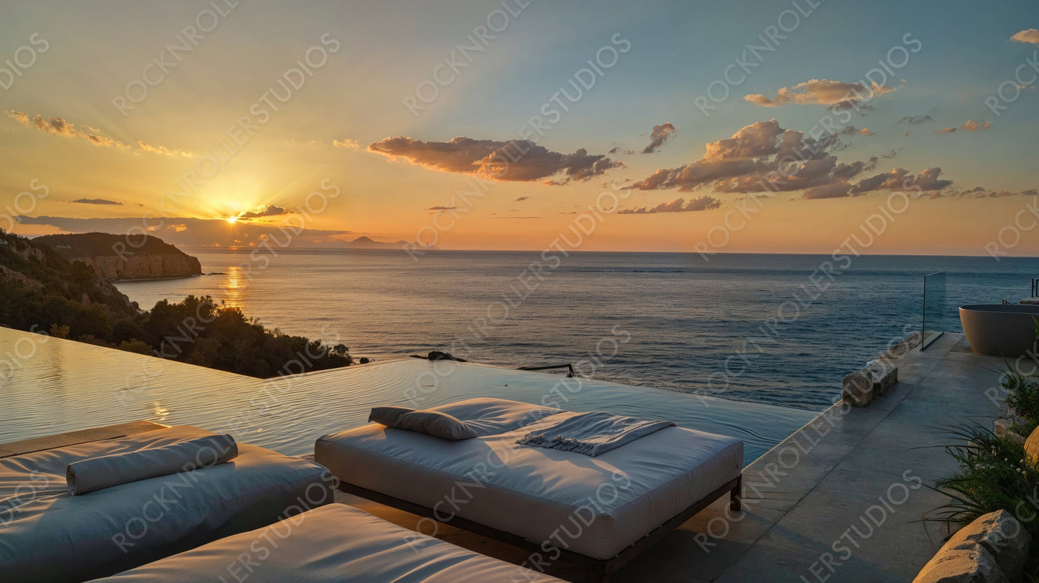 Serene Coastal Infinity Pool with Loungers Overlooking Beautiful Sunset View