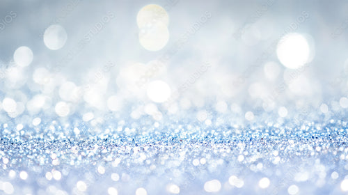 Magical Sparkling Blue Bokeh with Frosty Glitter for Winter Holiday Background