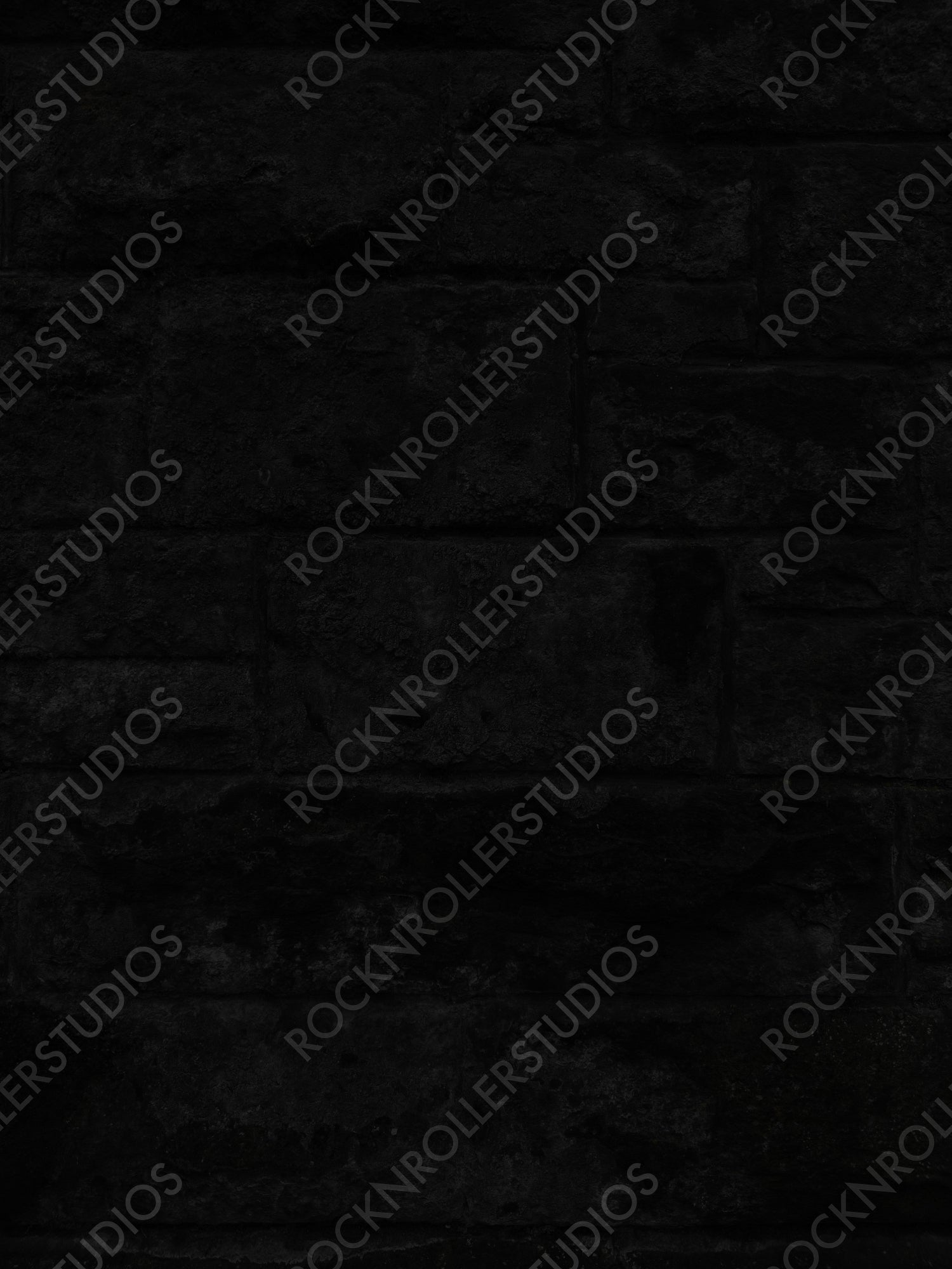 Dark Mystique: Textured Black Brick Wall with Rough, Staggered Pattern