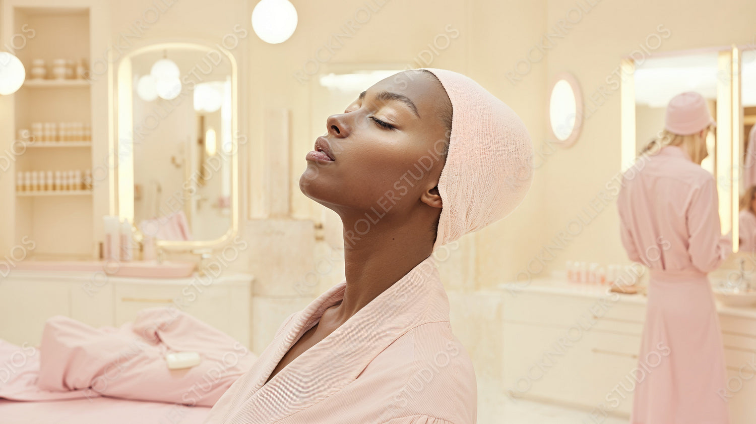 Tranquil Spa Day: Woman in Pink Robe Relaxes in Elegant Beauty Salon