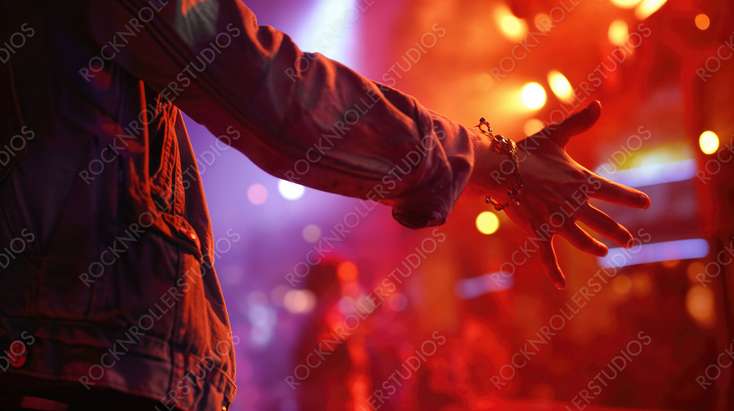Vibrant Party Energy: Hand in Denim Reaching Out at a Festive Concert