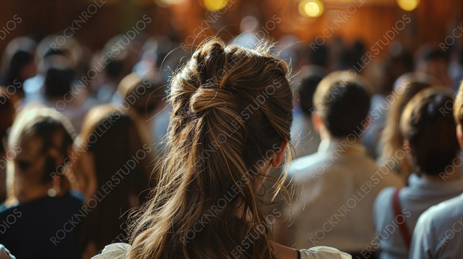 Back View of Woman with Stylish Hair in a Crowd