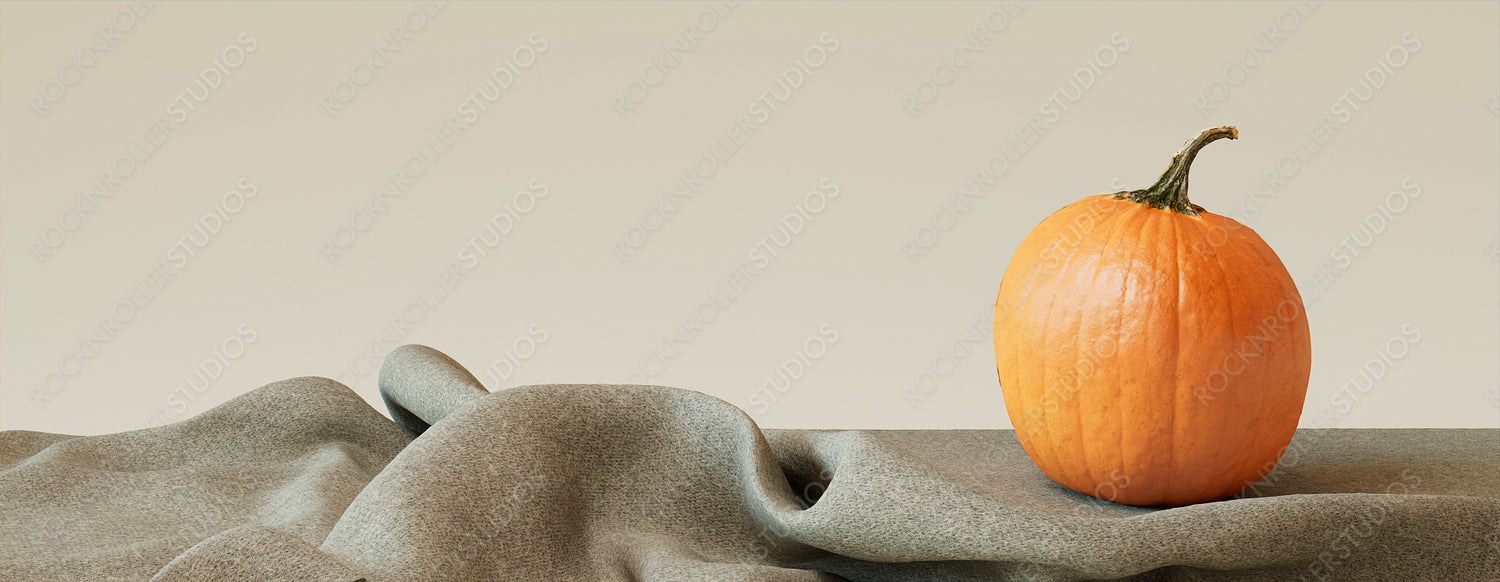 Contemporary Autumn Banner with Pumpkin on Grey Fabric.