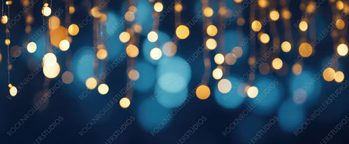 Holiday Illumination and Decoration Concept - Christmas Garland Bokeh Lights Over Dark Blue Background