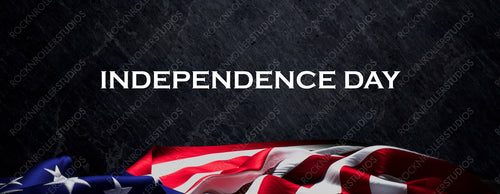 Independence Day Banner with US Flag and Black Slate Background.
