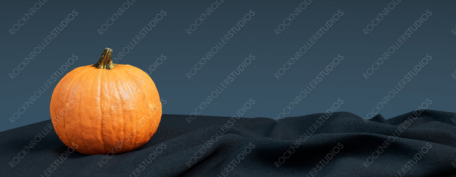 Contemporary Autumn Background with Pumpkin on Blue Grey Blanket.