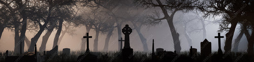 Trees and Gravestones Silhouetted in a Thick Pale Mist. Night scene in Spooky Graveyard. Halloween Concept.