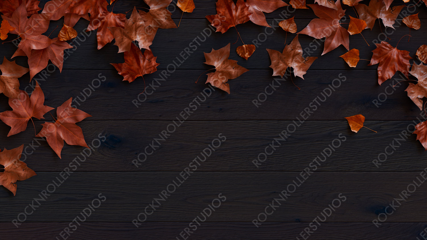 Top down view of Dark wood Tabletop with leaves.