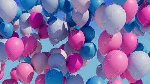 Colorful balloons rising into the in the air.