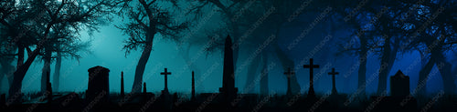 Trees and Gravestones Silhouetted in a Thick Blue Mist. Night scene in Eerie Graveyard. Halloween Concept.